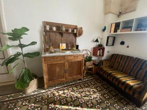 a living room with a couch and a table at Casa Marugii in Maruggio