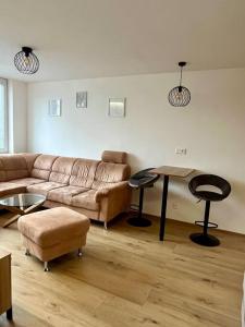 a living room with a couch and a table at Apartman Amur in Košice