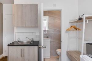 a bathroom with a sink and a toilet at The Best City Studio Near Public Transport in Ealing