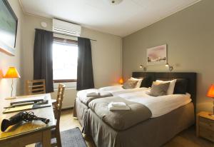 Postel nebo postele na pokoji v ubytování Park Hotell