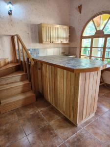 a kitchen with a large island in the middle at CasaDolomiti Coban Guest House in Cobán
