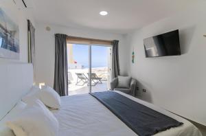 Postel nebo postele na pokoji v ubytování Mirador Balcon del Atlantico y piscina privada