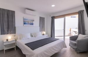 Postel nebo postele na pokoji v ubytování Mirador Balcon del Atlantico y piscina privada