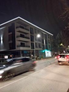 a car driving down a street in front of a building at Апартамент за гости Боляри 2 in Velingrad