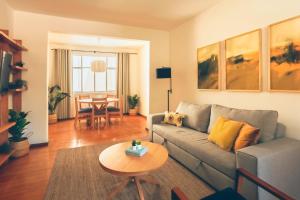 a living room with a couch and a table at AirTabacalera in Mexico City