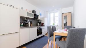Kuchyň nebo kuchyňský kout v ubytování Traunkai Apartments Bad Ischl