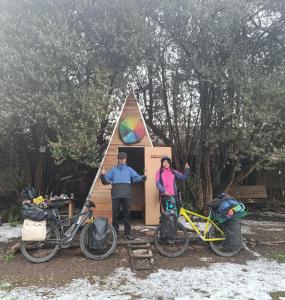 a group of three people standing in front of a tent at Hostal Casona Don Ranulfo in Peñas +2 photos