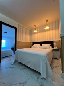 Cama ou camas em um quarto em Hotel Don Diego