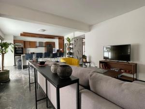 a living room with a couch and a table at Great apartment in the heart of Coyoacan in Mexico City