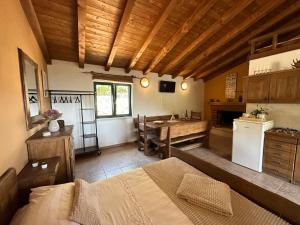a room with a kitchen and a table in a room at Kuća za odmor Samograd in Žrnovo +23 photos