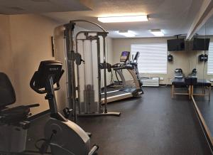a gym with several tread machines and a treadmill at Comfort Inn Falls Church - Tysons Corner in Falls Church