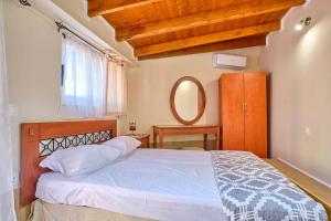 Postel nebo postele na pokoji v ubytování Villa Sanos