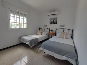 Кровать или кровати в номере splendid bungalow next to dunes +35 фотографий