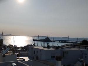 a view of a harbor with a boat in the water at Yacht Marine Maison in Naxos Chora