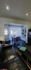 a living room with a couch and a table at La marine in Rogliano