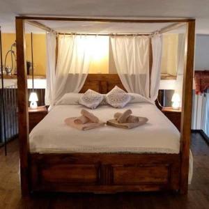 Säng eller sängar i ett rum på Loft le Pavoncelle