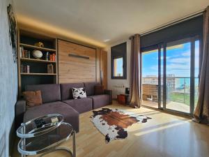 A seating area at Apartment Beach Front Canet