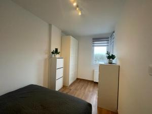 Postel nebo postele na pokoji v ubytování M3 Pruszków