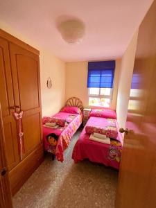 Ένα ή περισσότερα κρεβάτια σε δωμάτιο στο Apartamento en la Playa Canet, muy cerca de Valencia