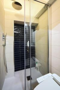 a glass shower in a bathroom with a toilet at Tra Amalfi, Pompei, Paestum in Salerno