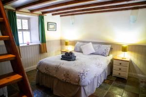 Postel nebo postele na pokoji v ubytování Ghleann Éada Cottage