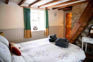 Voodi või voodid majutusasutuse Ghleann Éada Cottage toas