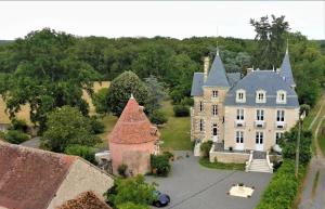 an aerial view of a large house with turrets at VILLA SAINT PIERRE in La Trimouille