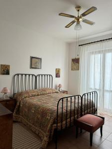 En eller flere senge i et værelse på Lilly & Gisa casa vacanze