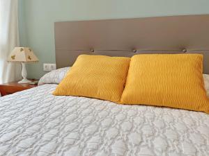 Postel nebo postele na pokoji v ubytování Wallada San Hipólito