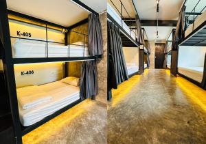 two bunk beds in a room with a hallway at Adora Hostel in Chiang Mai