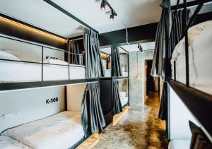 a room with two bunk beds in it at Adora Hostel in Chiang Mai
