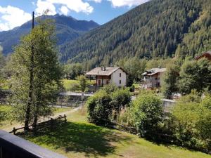 a view from the balcony of a house in the mountains at Appartamento Valdobbia in Gressoney-Saint-Jean