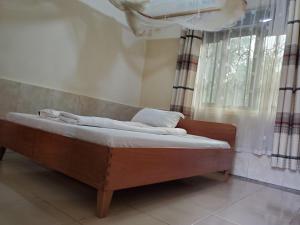 Postel nebo postele na pokoji v ubytování Mackline Rest House