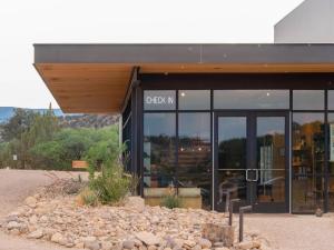 a building with a sign on the front of it at Ofland Escalante in Escalante