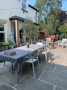 a table and chairs sitting on a patio at Time House Cottage in Huby