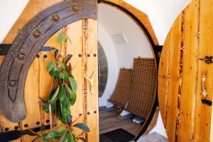 a large wooden door with a mirror next to it at Casa Ballena, Finca La Lama Romana Bodonal de la Sierra in Bodonal de la Sierra