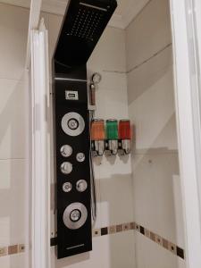 a control panel of a shower in a bathroom at VIVIENDA de uso TURISTICO in Bóveda