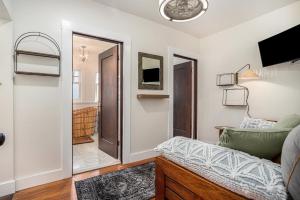 a living room with a couch and a television at Maple Family Suite in Berkeley