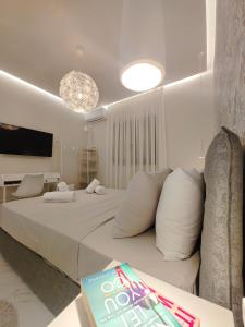 Postel nebo postele na pokoji v ubytování Volos Guesthouse Chrysa