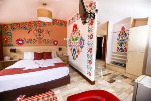 Postel nebo postele na pokoji v ubytování Mayu Boutique Hotel