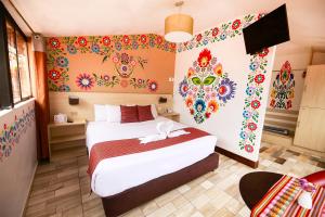 Postel nebo postele na pokoji v ubytování Mayu Boutique Hotel