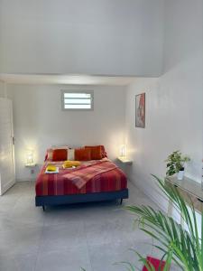 Ένα ή περισσότερα κρεβάτια σε δωμάτιο στο Les Villas du Bambou - Villa PAPRIKA jusqu'à 6 pers