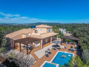 an aerial view of a house with a swimming pool at Stunning Countryside Villa w Private Garden & Pool in Alte