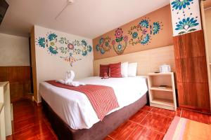 Postel nebo postele na pokoji v ubytování Mayu Boutique Hotel