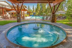 a large swimming pool with blue water at Northstar Ski Trails Condo Walk to Village 3 Year-Round Hot Tubs in Rec. Center in Truckee