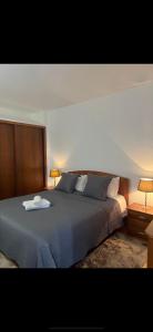 a bedroom with a large bed with a tray on it at Discovery Apartment with patio Discovery 2 in Machico