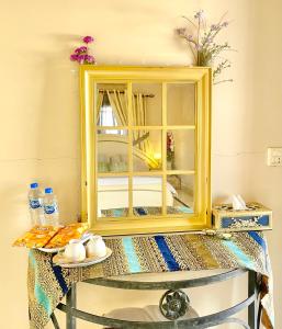 a mirror sitting on top of a table at Mohalla Rooftop Retreat in Karachi