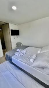 Ein Bett oder Betten in einem Zimmer der Unterkunft La Magnifica by Olamar Living