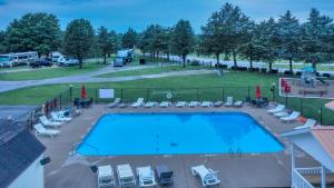 an aerial view of a large swimming pool with a park at Secluded Rustic Cabin with Views in Bloomington