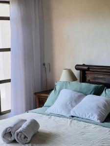 Ein Bett oder Betten in einem Zimmer der Unterkunft Casa entera en centro histórico